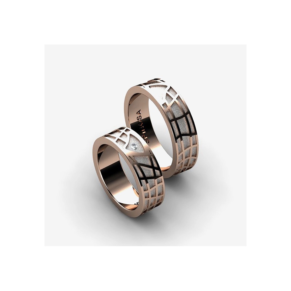 gold wedding rings with a geometric pattern design