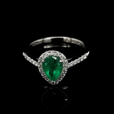 EMERALD RING WITH HALO AND SIDE DIAMONDS