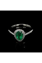 EMERALD RING WITH HALO AND SIDE DIAMONDS