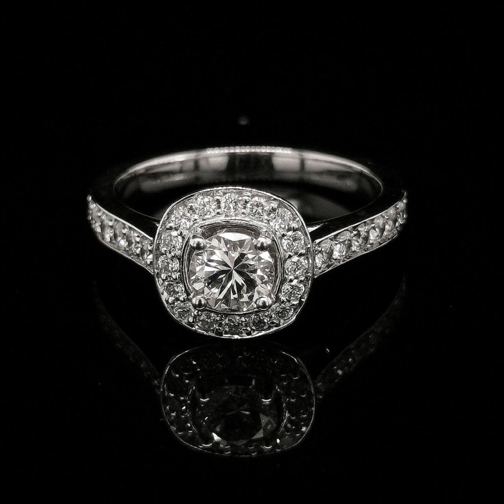 HALO ENGAGEMENT RING WITH 0.47 CT. CENTRAL DIAMOND