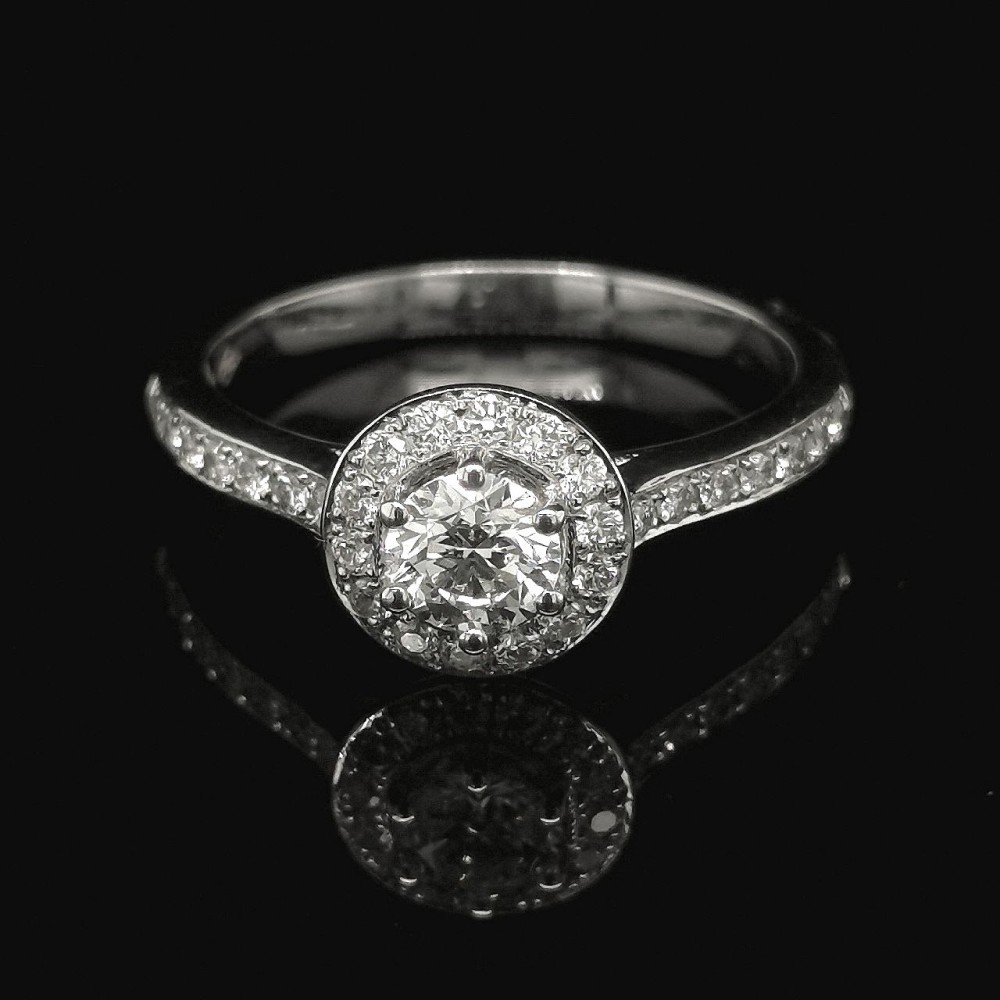 0.41 CT. CENTRAL DIAMOND RING WITH HALO