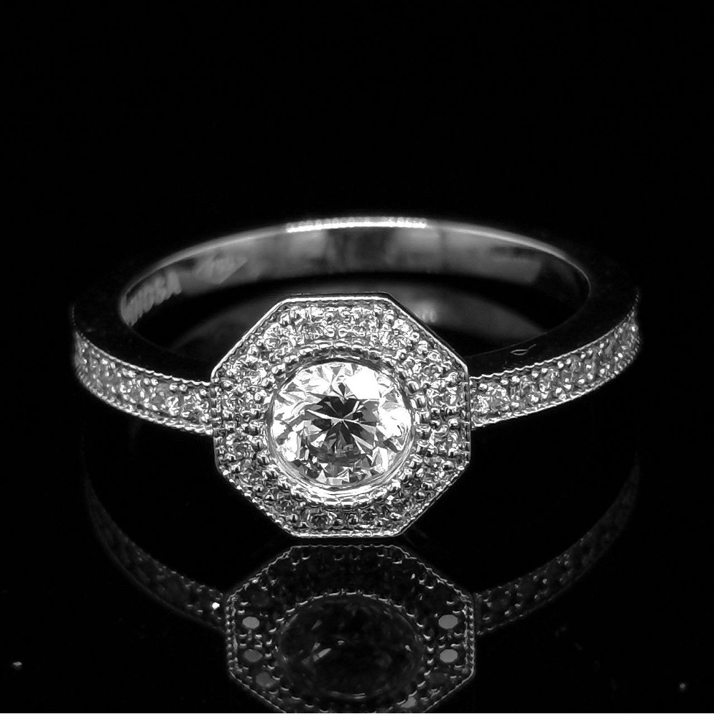 0.43 CT. CENTRAL DIAMOND RING WITH ACCENTS