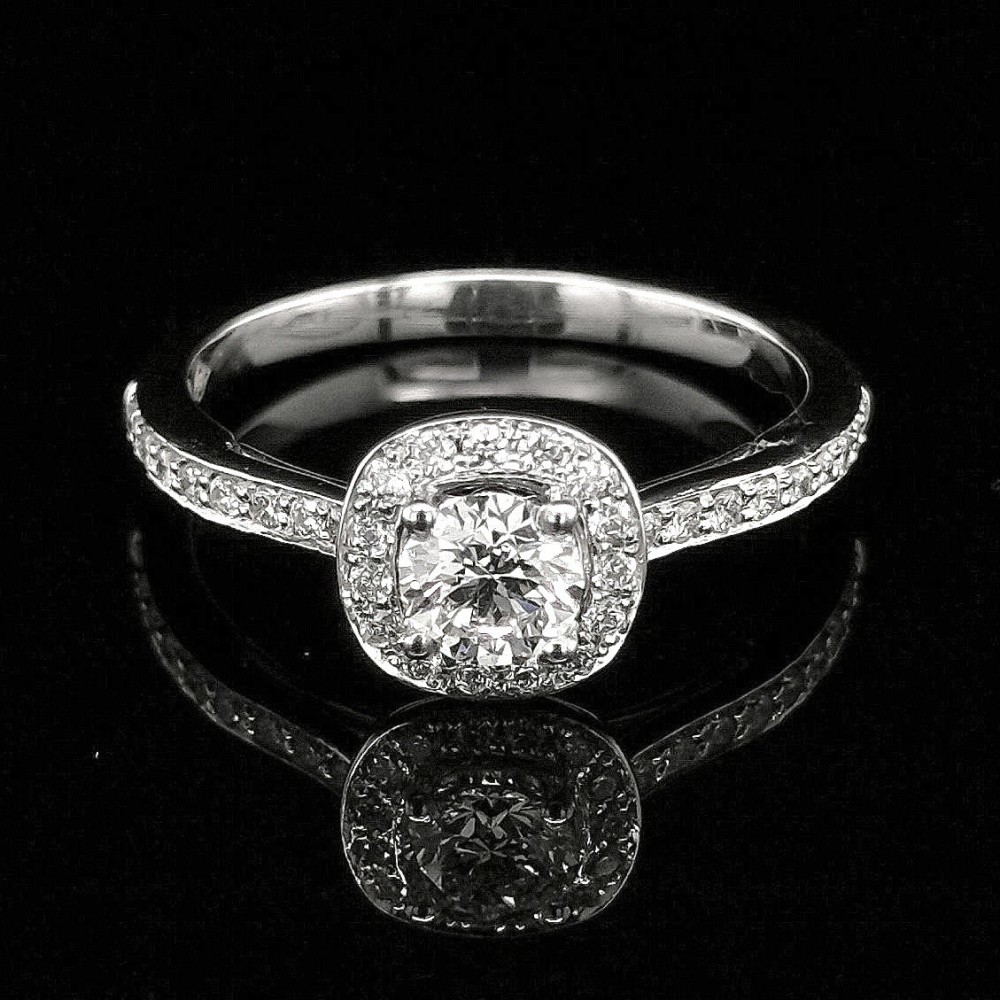 0.51 CT. CENTRAL DIAMOND ENGAGEMENT RING WITH HALO