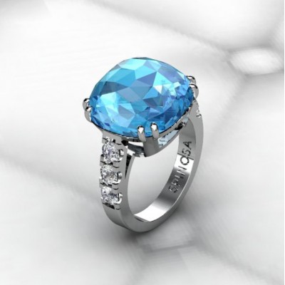 anillo con topacio azul en talla cojin y brillantes